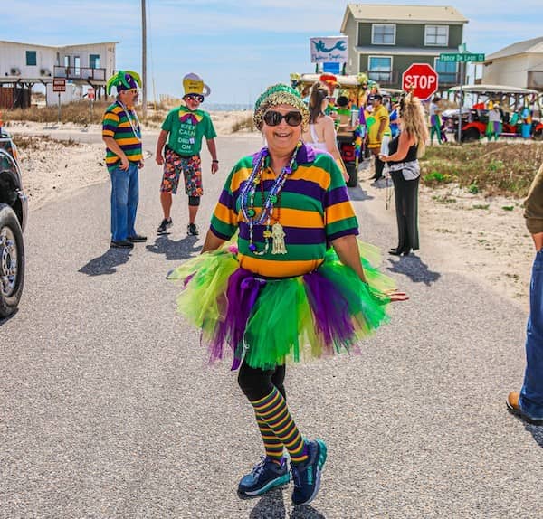 Lady posing in Fort Morgan parade with hands down.